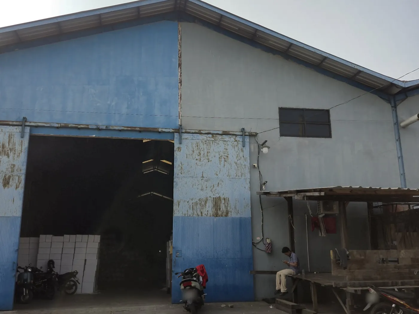 Front of the warehouse with its sliding doors open